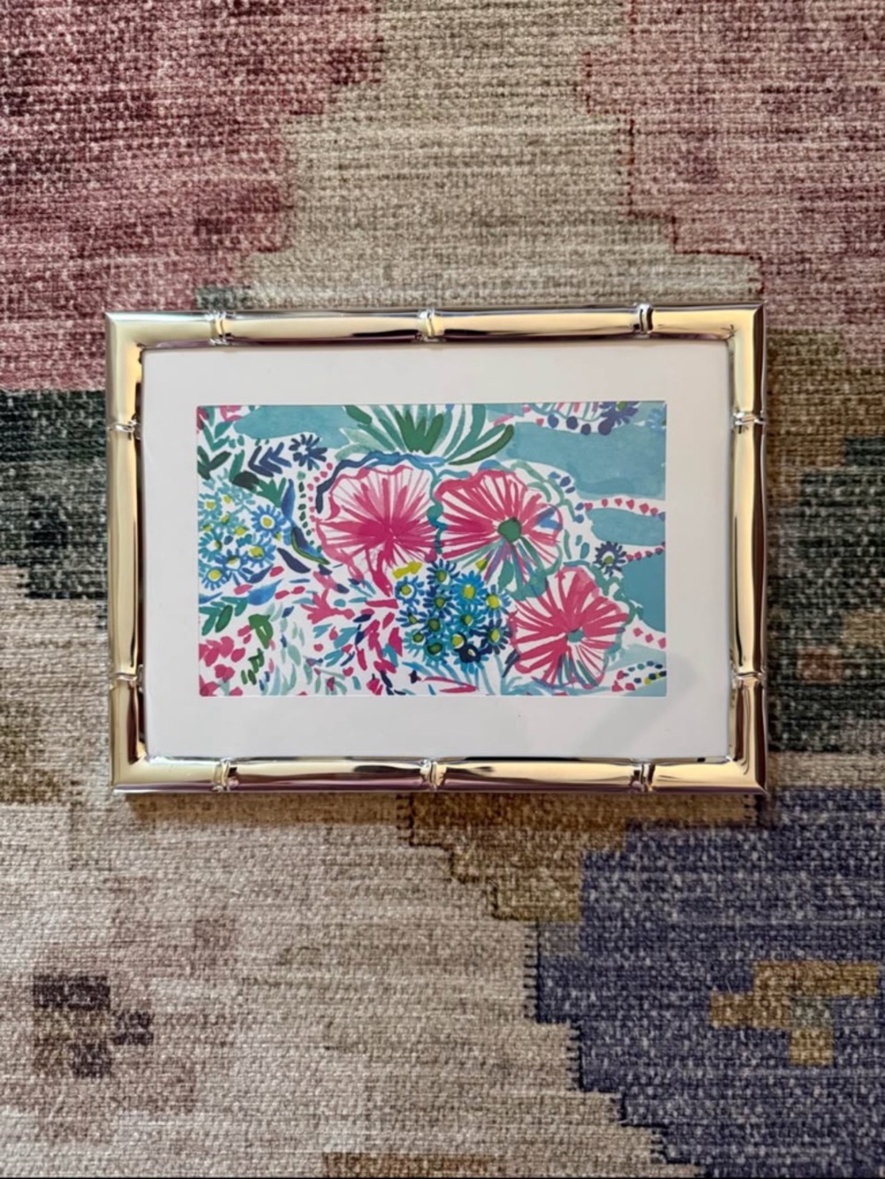 Lilly Pulitzer "under the sea" print in silver bamboo frame. Measures 5"x7"
